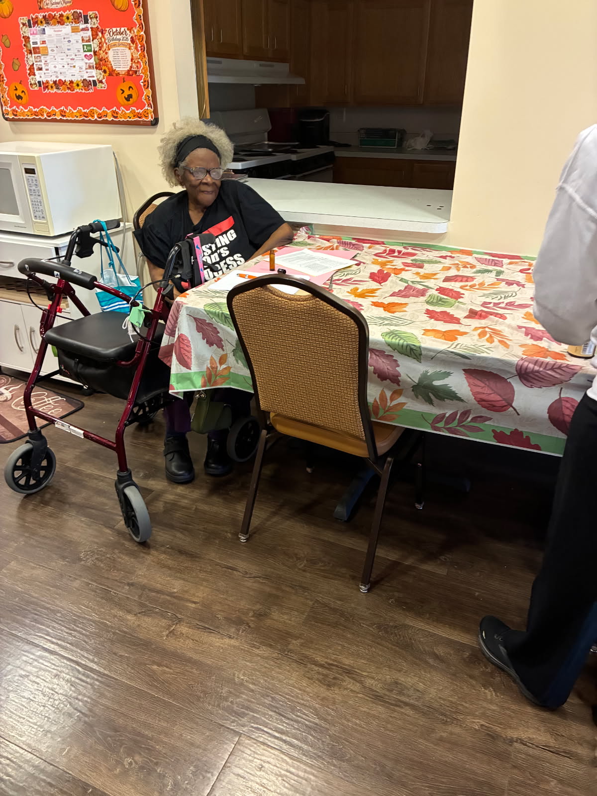 A guest seated at the workshop table with her handout and roller bottle supplies
